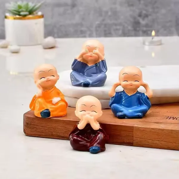 Set of 4 resin Buddha monks for gifting and spiritual decoration